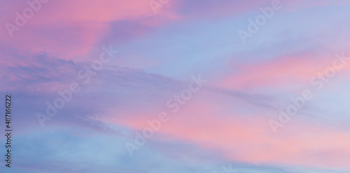 Beautiful soft pastel long panorama clouds sky background © kardd