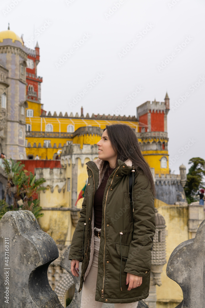 Young female tourist visiting the palace da pena in Sintra