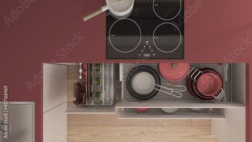 Red and wooden kitchen close up with open drawers with plates, pots, bottles, wooden spoons and accessories. Sink, induction hob with pan. Top view, plan, above, interior design