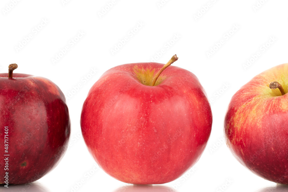 Three ripe red apples, macro, isolated on white background. Three ripe red apples, macro, isolated on white background.