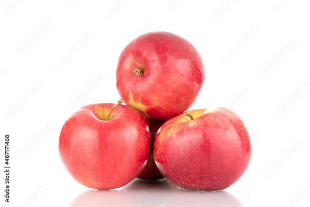 Three ripe red apples, macro, isolated on white background.