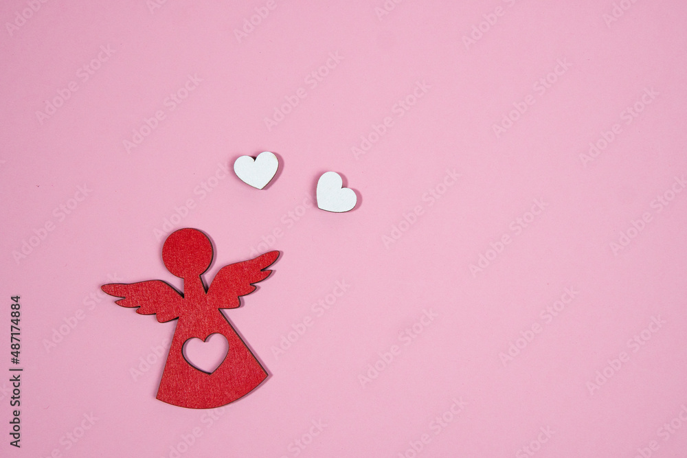 angel with two hearts on a pink background