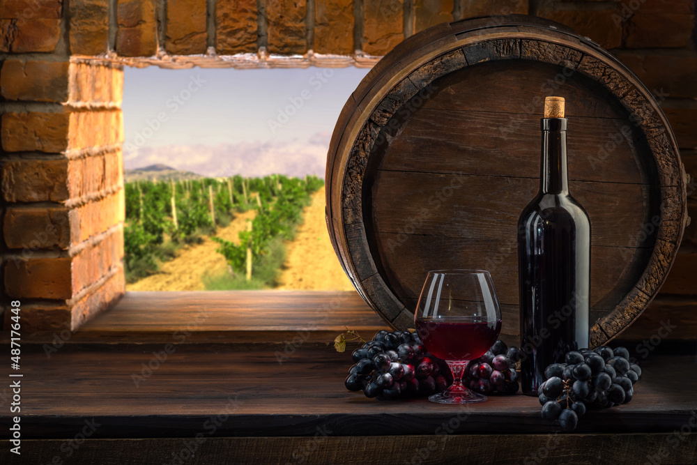 Wine glasses with tall stem. Old oak barrel in a dark wine cellar at the winery. Aging cellaring wine tasting