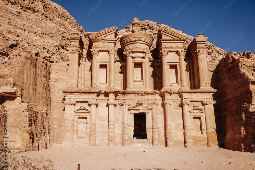 Facade of the temple in the ancient city of Petra. Jordan. Temple in red sandstone rock on a clear sunny day