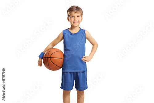 Boy in a blue jersey holding a basketball and smiling © Ljupco Smokovski