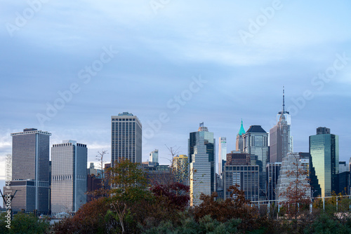 Financial district skyline of downtown New York City, Modern buildings over trees