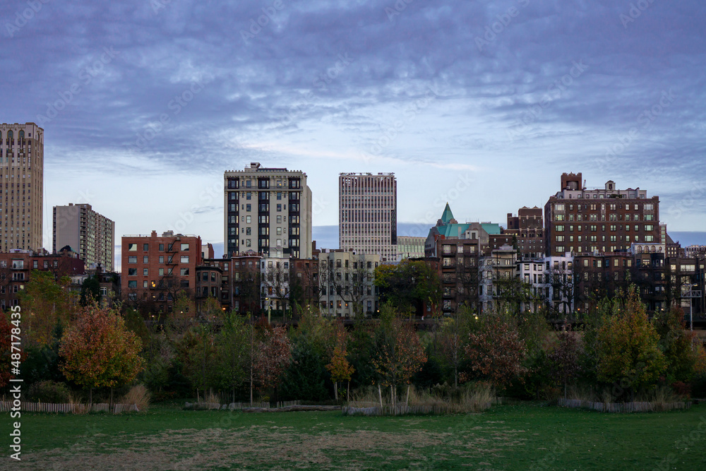 Skyline of Apartment buildings in Brooklyn Heights, NY. Historic and modern buildings over trees in autumn season