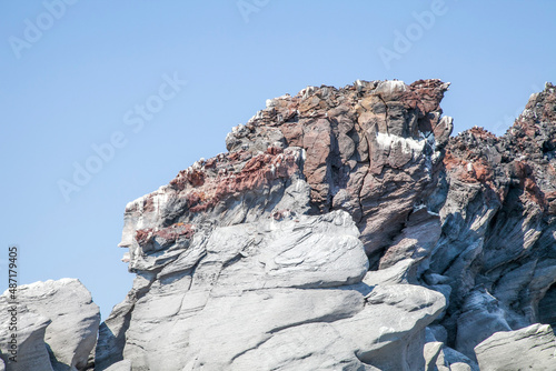 formaciones rocosas de forma extraña con cielo azul en el fondo photo