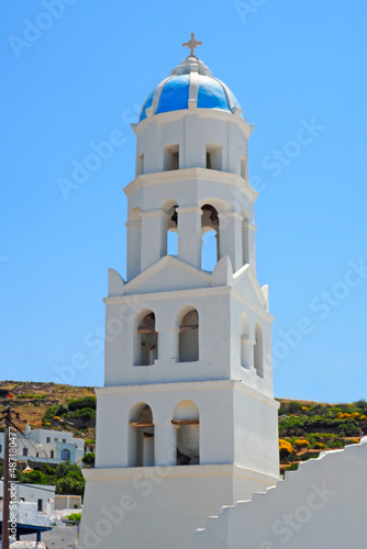 On the island of Tinos, in the Cyclades, in the heart of the Aegean Sea and at the foot of mount exobourgo, view of the blue bell tower of the orthodox church in the village of Tripotamos