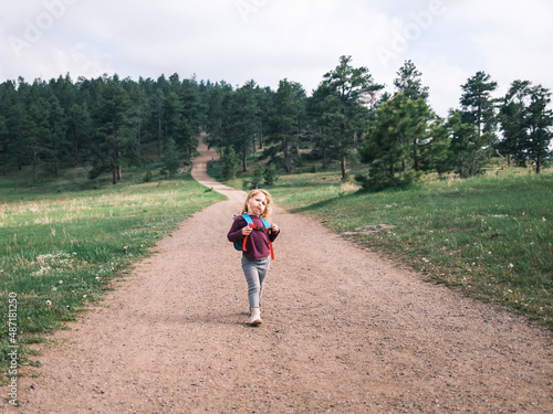 Girl hiking on a trail in Mount Falcon Park photo