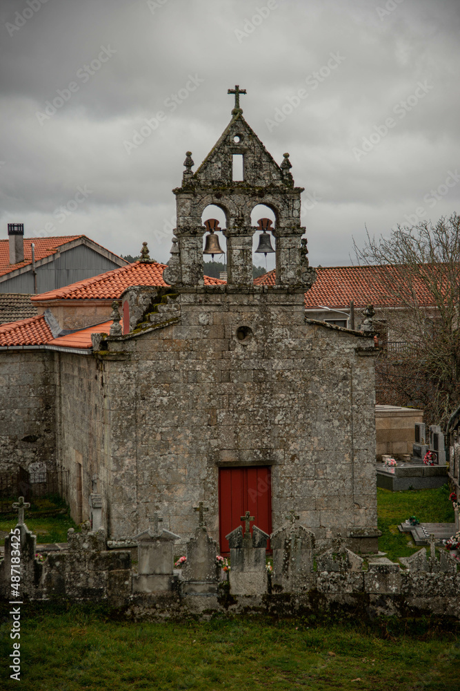 Facade of a village chapel with a cemetery typical construction of small parishes in the interior of Galicia