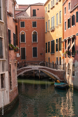 Boat and bridge in a canal, Venice, Italy © JUAN