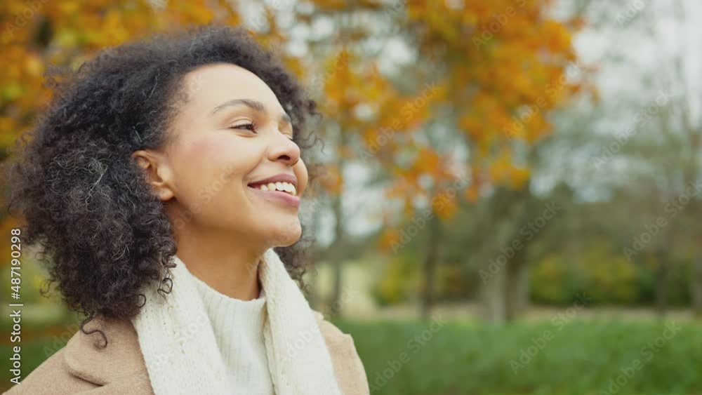 Head and shoulders portrait of beautiful woman on walk through autumn countryside - shot in slow motion Head and shoulders portrait of beautiful woman on walk through autumn countryside - shot in slow motion