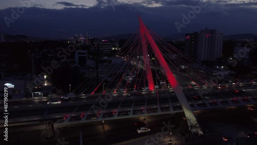 evening flying clockwise around Matute Remus Bridge in Guadalajara Mexico photo