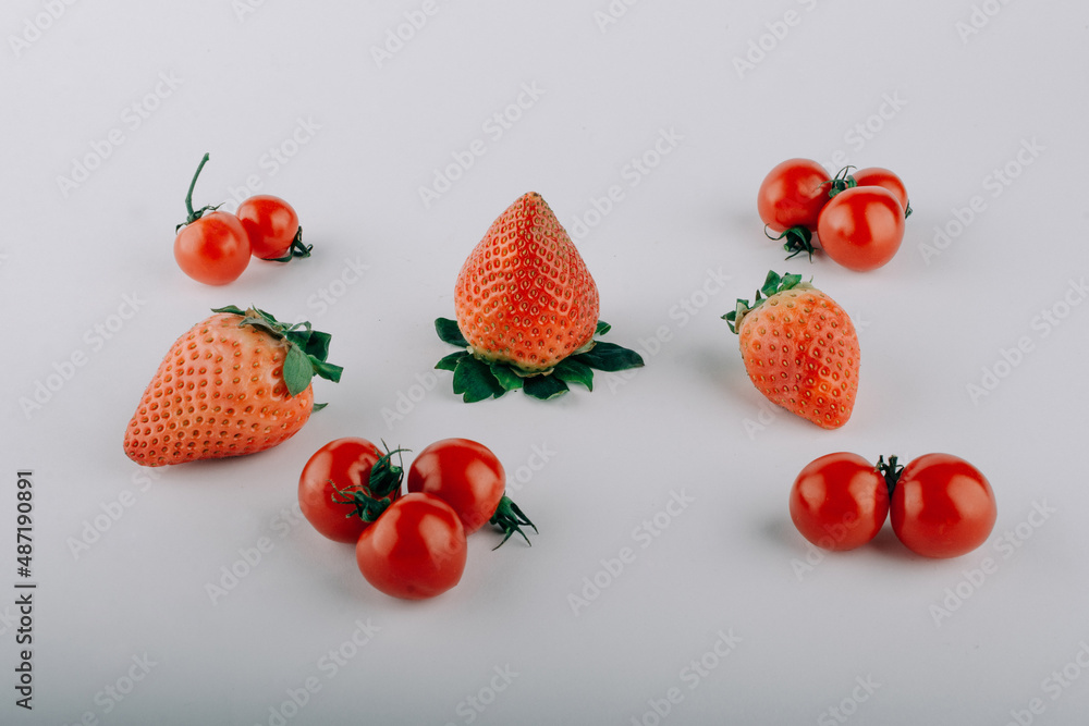 ripe tomatoes and strawberries ripe tomatoes and strawberries