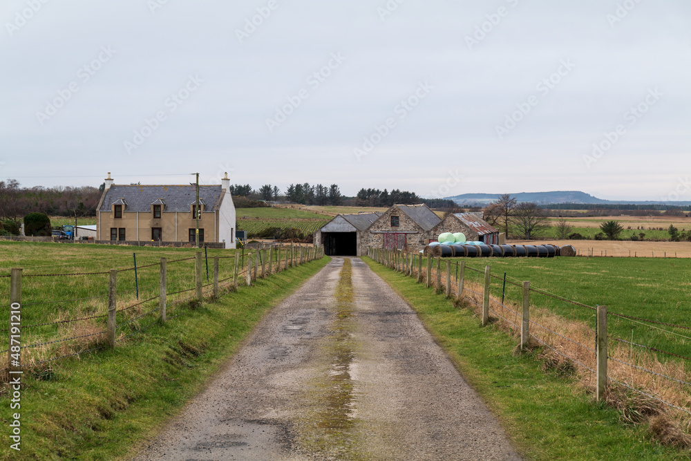 PORTGORDON,MORAY,SCOTLAND - 13 FEBRUARY 2022: This is the road leading to a Farmhouse and its outbuildings in Portgordon, Moray, Scotland on 13 February 2022 PORTGORDON,MORAY,SCOTLAND - 13 FEBRUARY 2022: This is the road leading to a Farmhouse and its outbuildings in Portgordon, Moray, Scotland on 13 February 2022