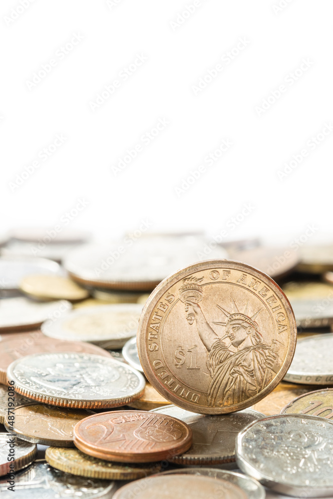 One dollar coin and other different coins One dollar coin and other different coins