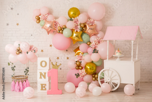 Pink decor with flowers for first birthday