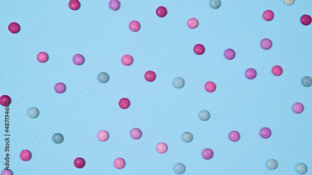 Pastel gummy candies make creative pattern on bright cyan background. Stop motion flat lay concept Pastel gummy candies make creative pattern on bright cyan background. Stop motion flat lay concept