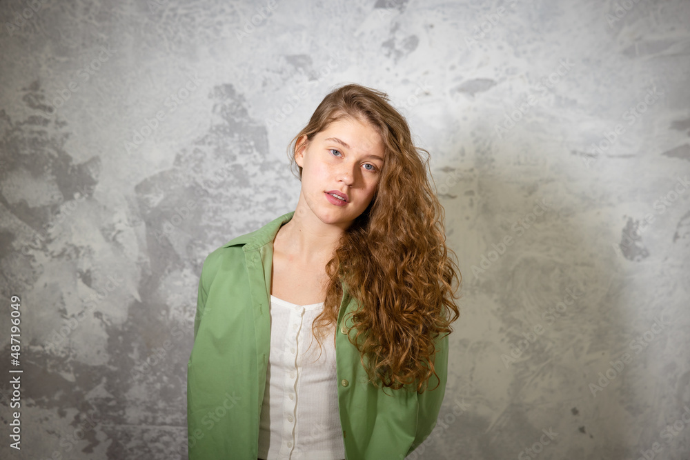 Pretty female looking at camera. Studio shot of beautiful woman. Pretty female looking at camera. Studio shot of beautiful woman.