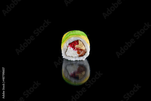 rolls with salmon and avocado and cheese,roll on black background with mango and avocado