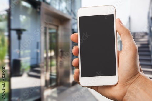Hand with smartphone with empty blank screen