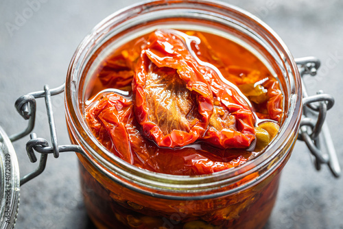 Sun dried tomatoe. Pickled tomatoes in jar.