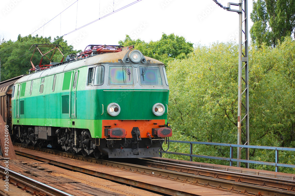 Train hauled by electric locomotive on a sunny day. Train hauled by electric locomotive on a sunny day.