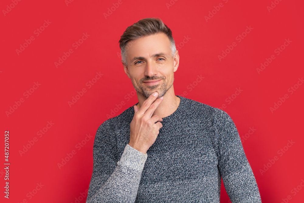 smiling handsome man wear sweater on red background, portrait smiling handsome man wear sweater on red background, portrait