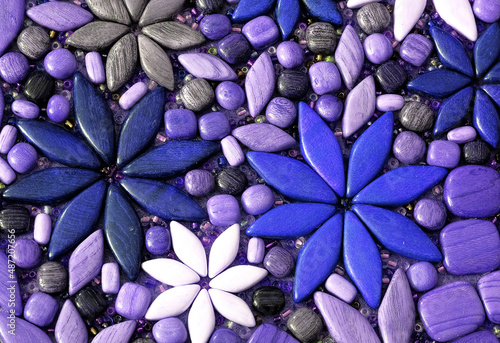 Flower petals and background of blue  purple  white and gray stones