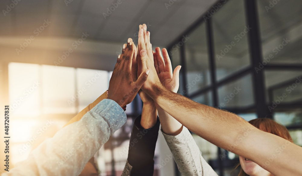 We always win. Shot of a group of colleagues giving each other a high five. - obrazy, fototapety, plakaty 