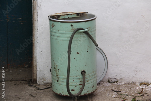 Old vintage light green with a rubber hose home washing machine produced in the second half of the 20th century