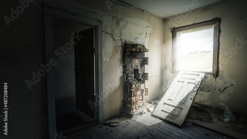 Old abandoned building with sunlight rays from the window