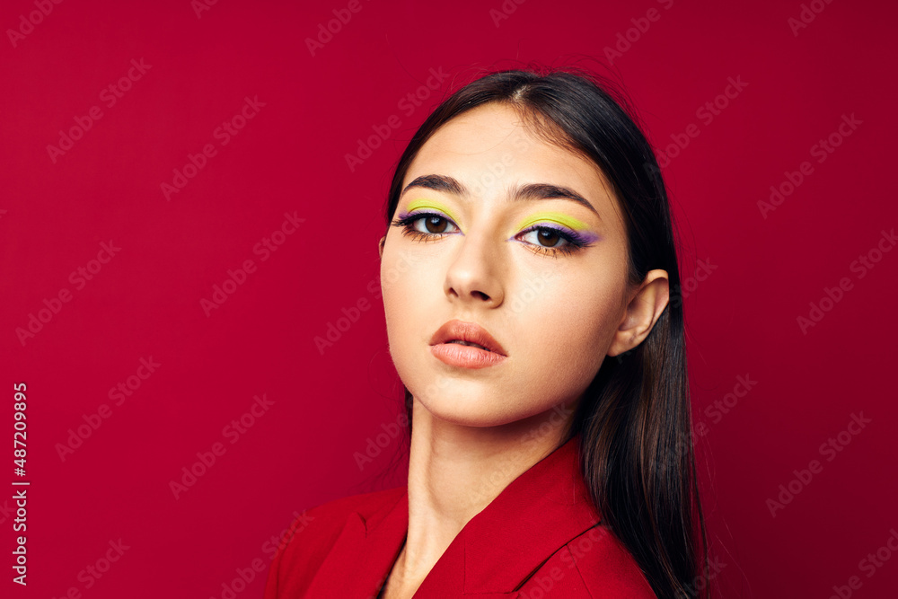 Fototapeta premium attractive girl fashion posing in red jacket isolated background unaltered