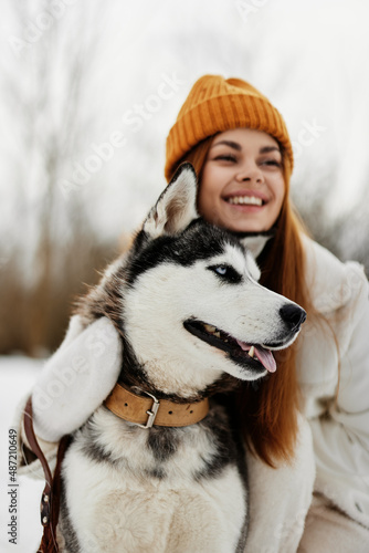 woman with a purebred dog on the snow walk play rest winter holidays © SHOTPRIME STUDIO
