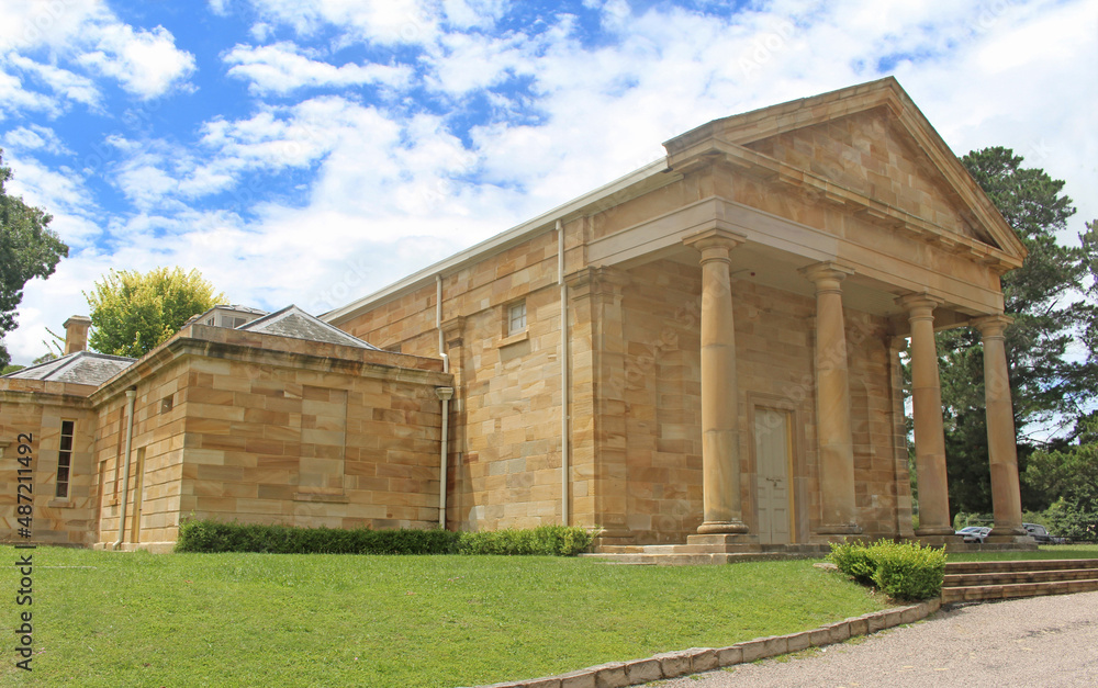 Historic sandstone Berrima Courthouse. Built in the Regency Style. The facade consists of four Doric columns with classic Greek bases and capitals