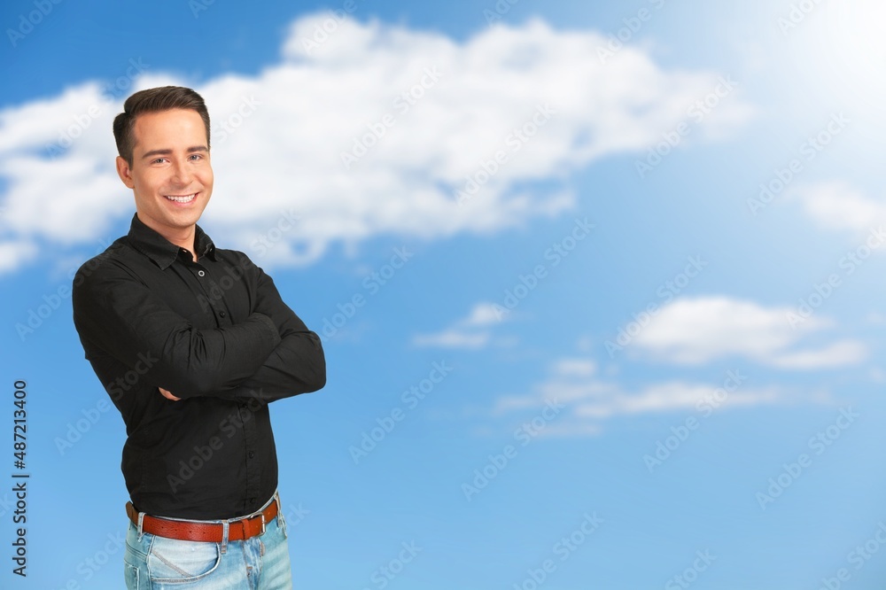 Cheerful Guy Smiling To Camera Posing Crossing Hands Standing Over Background. Cheerful Guy Smiling To Camera Posing Crossing Hands Standing Over Background.