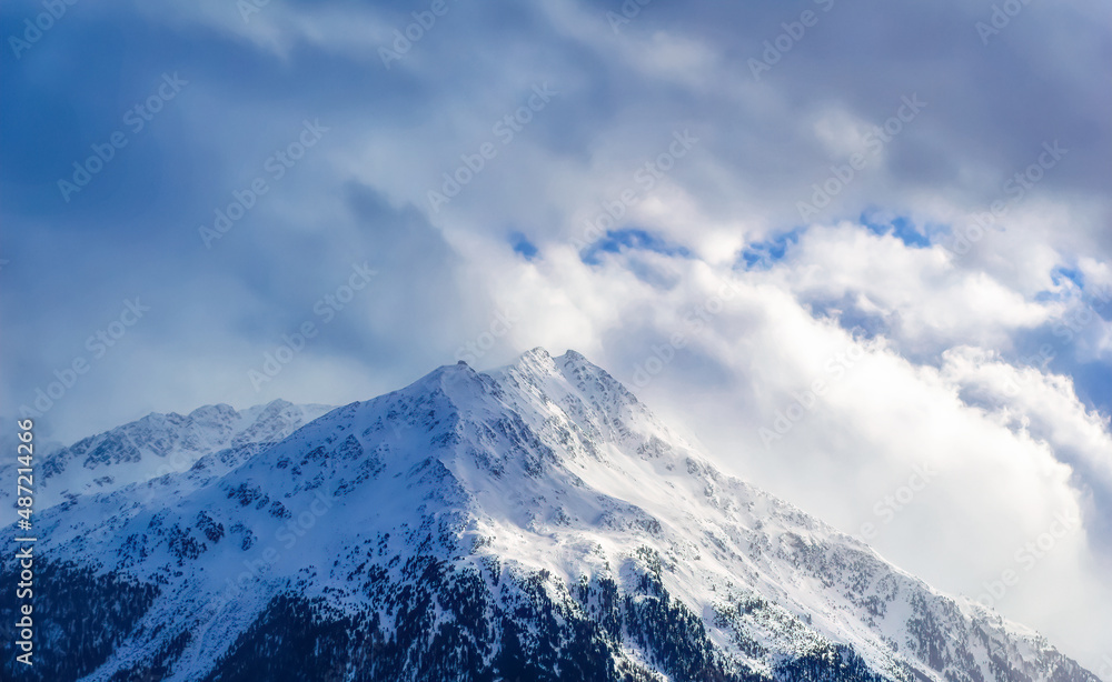 Mountain peaks covered with snow during winter time in Tirol, Austria.