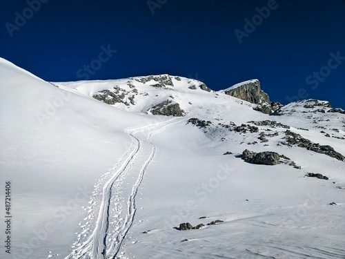 ski touring trail on the mountain mutteristock in Switzerland. Beautiful slope in deep snow. Ski mountaineering, skimo photo