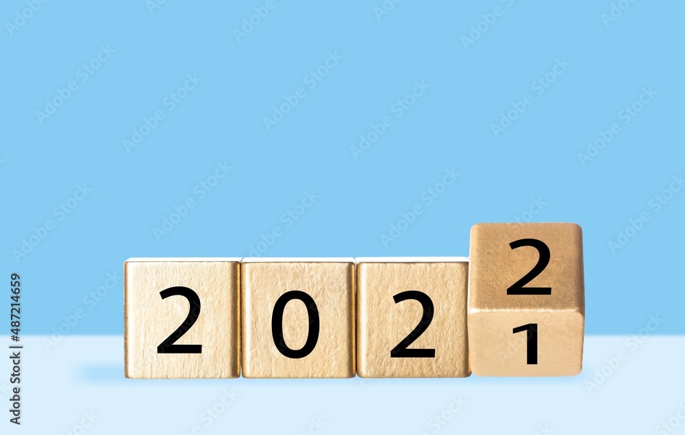 woodblocks cubes with a number 2021 change to 2022 . new year 2021- 2022 concept. woodblocks cubes with a number 2021 change to 2022 . new year 2021- 2022 concept.