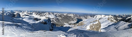 Beautiful mountain panorama from the mutteristock summit to the wagitalersee in the canton of Schwyz. Ski mountaineering