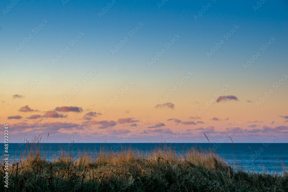 Sunset in the dunes by the North Sea