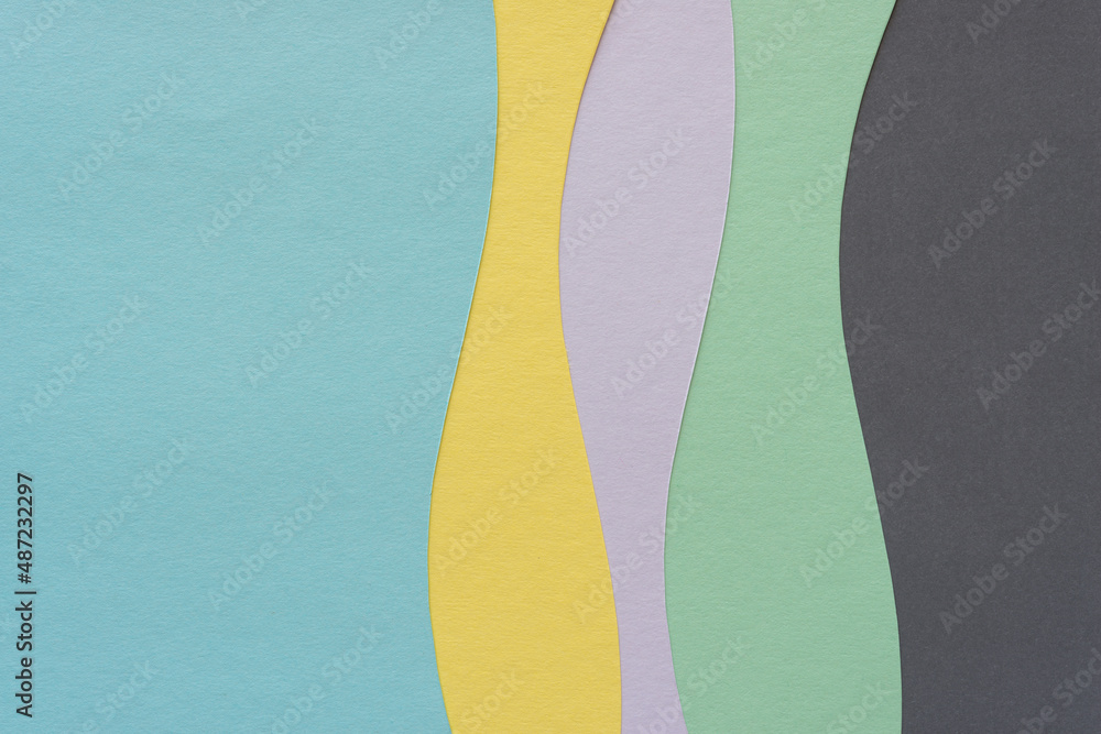 paper design with wavy lines and blank space in blue, yellow, mauve, green, and gray paper design with wavy lines and blank space in blue, yellow, mauve, green, and gray