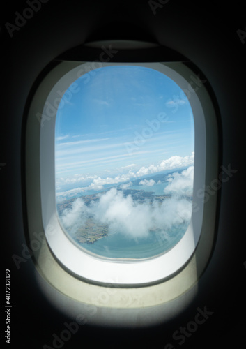 View from Airplane Window as it Takes Off from Auckland New Zealand on a Cloudy Day