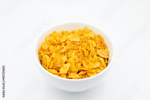 фотографія Corn Flakes, in a white bowl, isolated on a white background