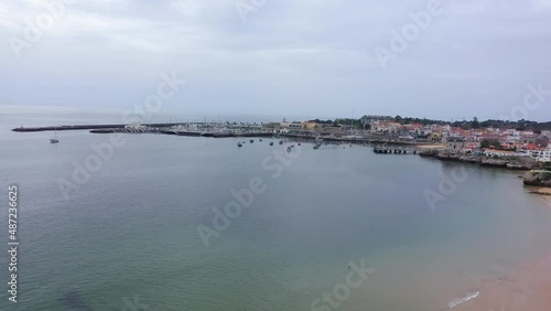 Wallpaper Mural Aerial view of the coast of Cascais in cloudy Lisbon, Portugal - circling, drone shot Torontodigital.ca