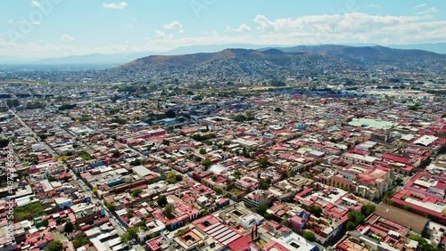 Oaxaca City Mexico. Drone Aerial View Of Colonial Mexican City Blocks And Streets During Bright Colorful Vibrant Daylight With Partly Cloudy Sky. photo