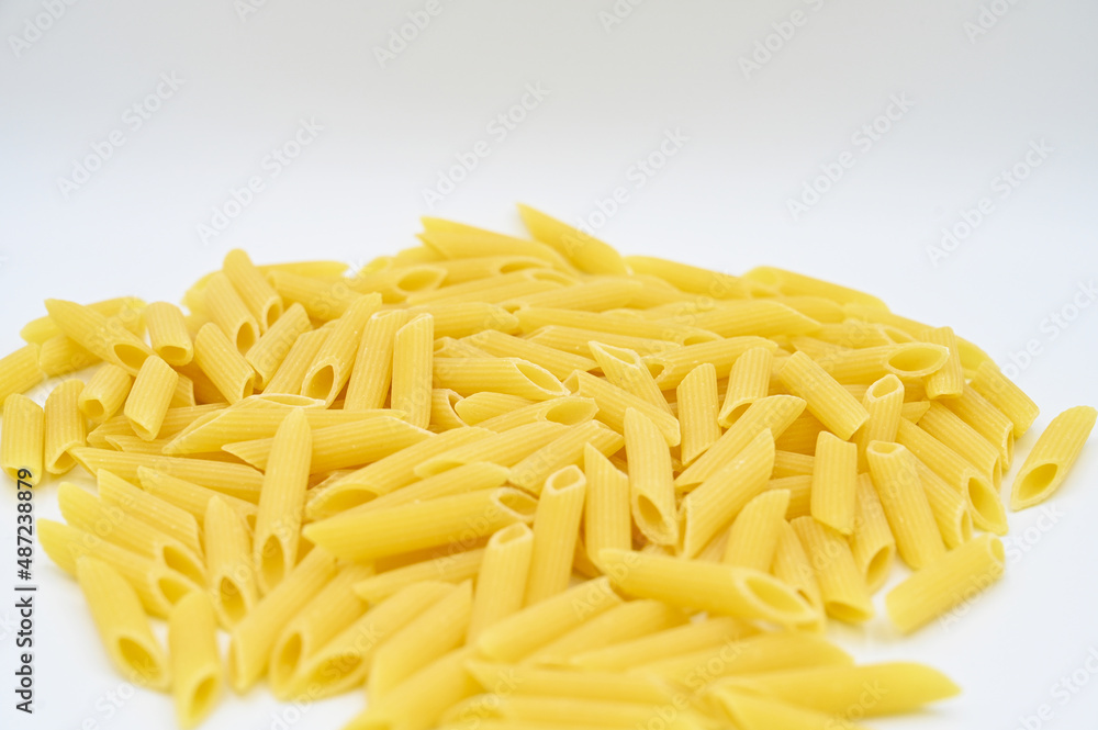 Raw penne rigate pasta, isolated on a white background
Raw penne rigate pasta, isolated on a white background