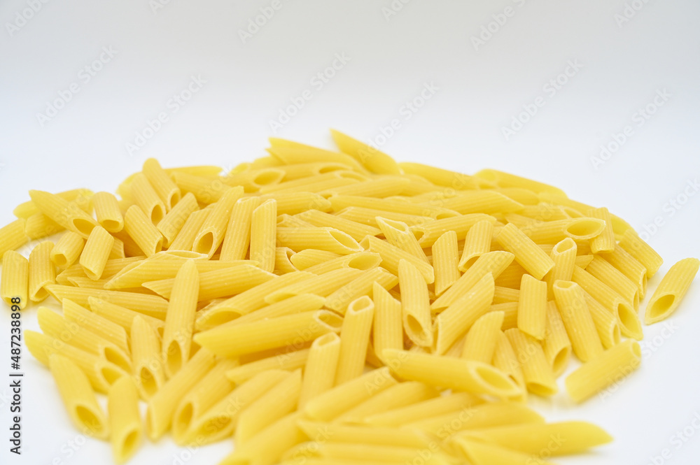 Raw penne rigate pasta, isolated on a white background
Raw penne rigate pasta, isolated on a white background