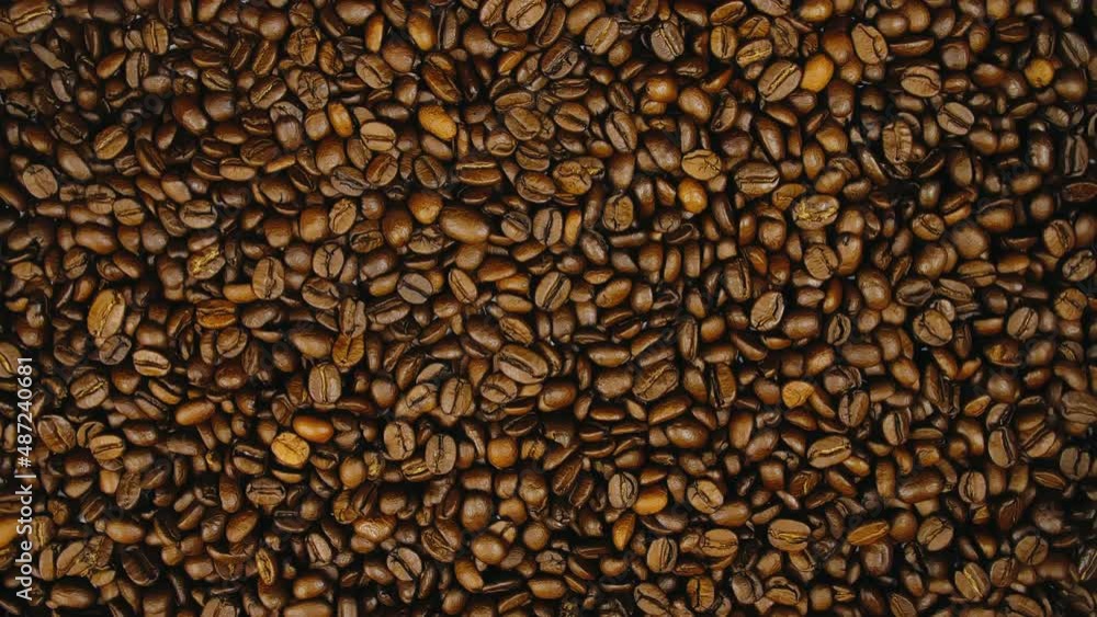 The coffee beans on the turntable. The coffee beans spin rotate. Twist, create pattern, make design picture. The coffee beans on the turntable. The coffee beans spin rotate. Twist, create pattern, make design picture.